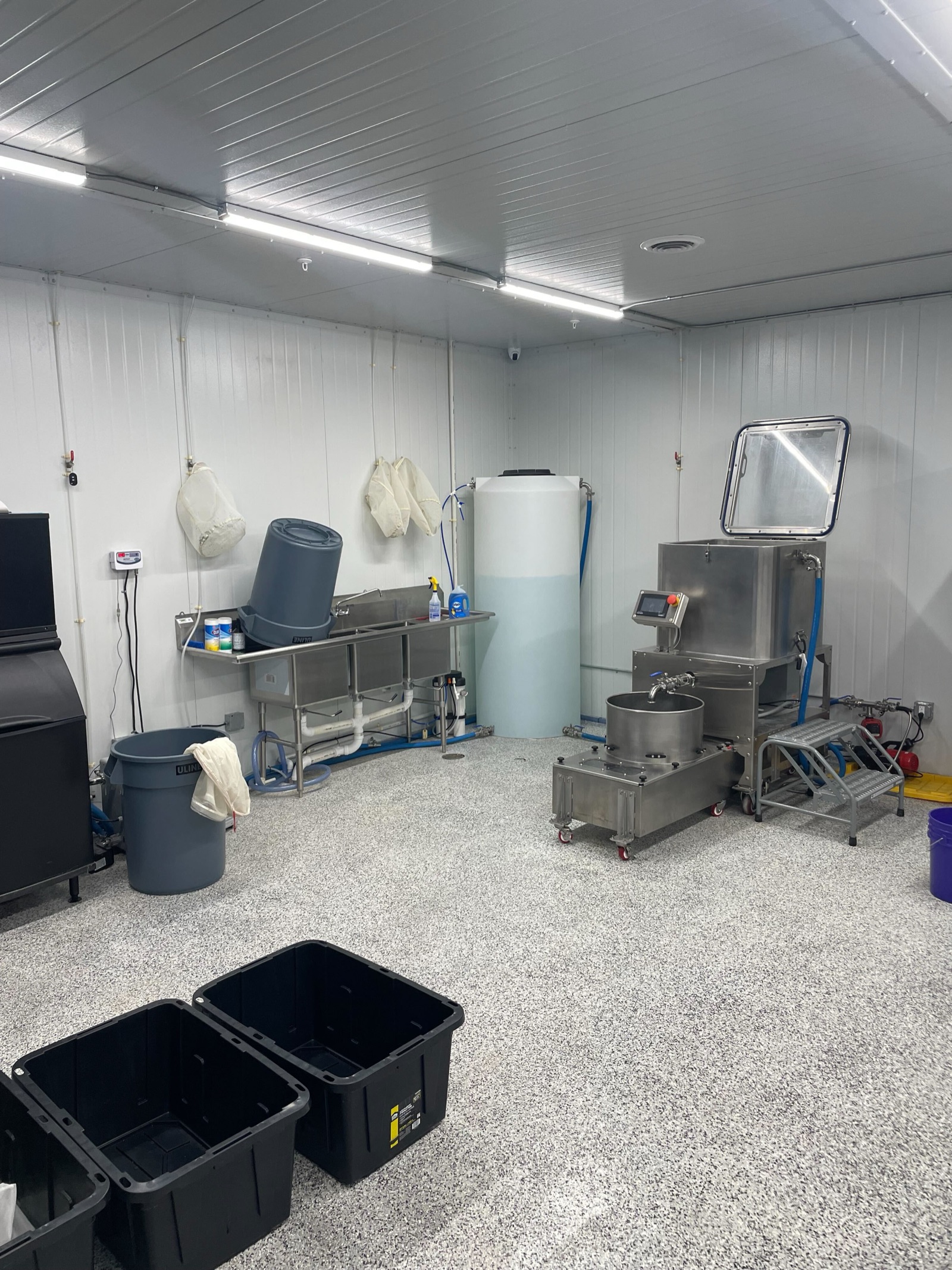Finished processing room with stainless equipment and utility sink
