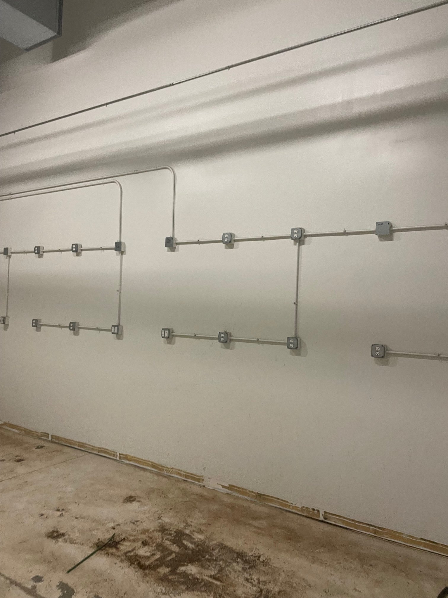 Conduit runs across grow room walls