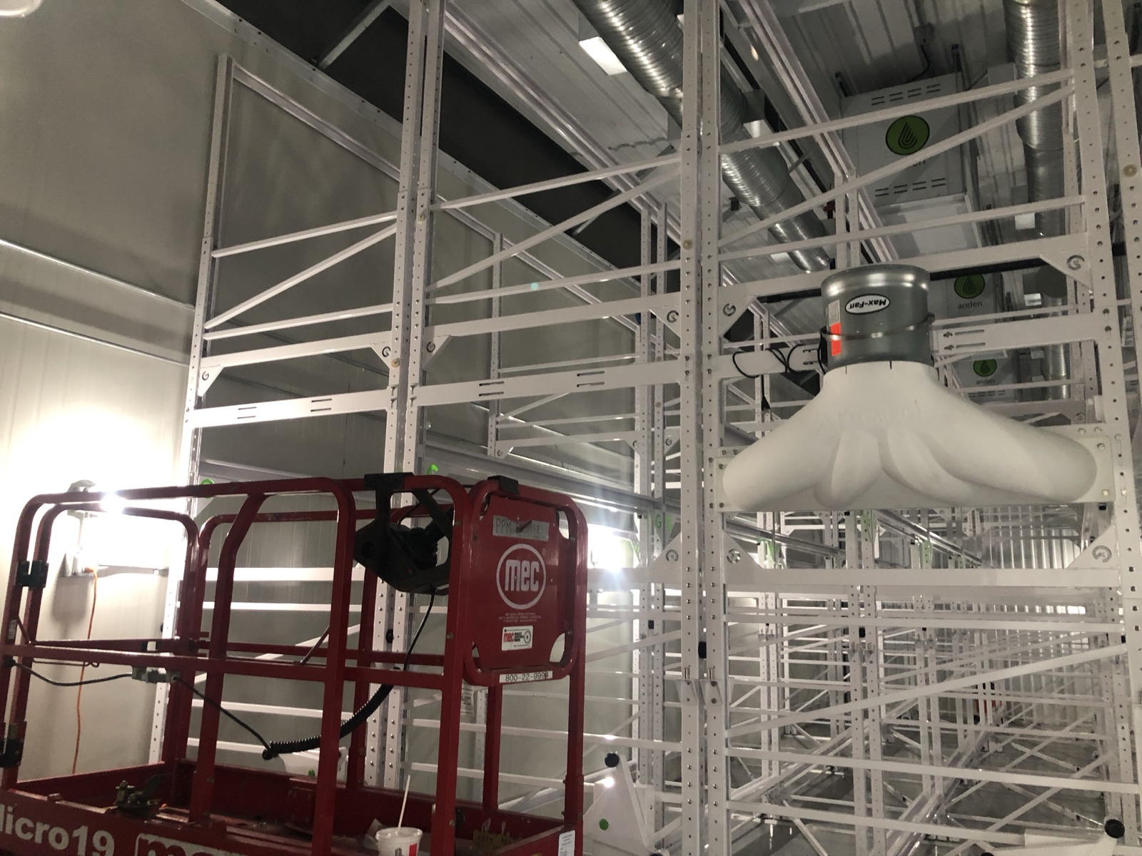 Mobile racking installed with overhead circulation fans and dehumidification units