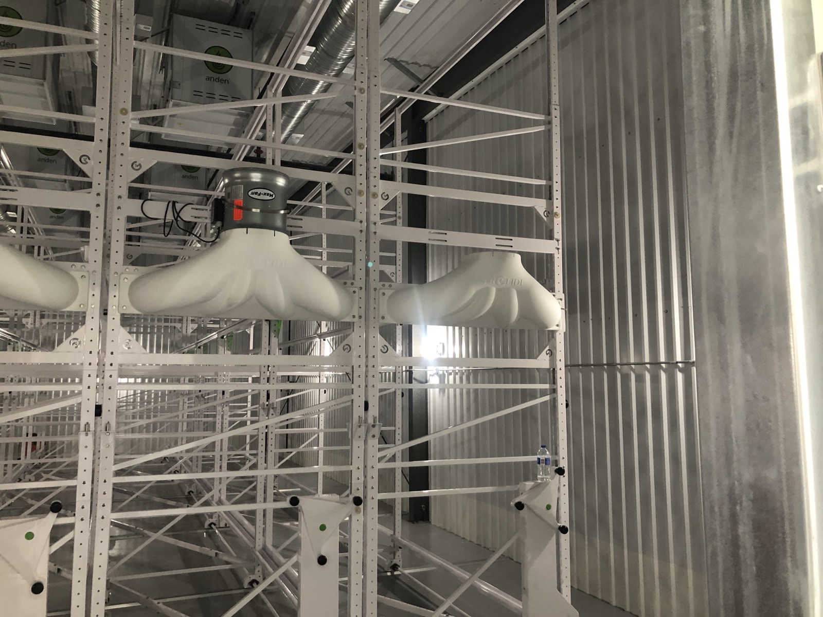 Circulation fans mounted along the mobile racking system