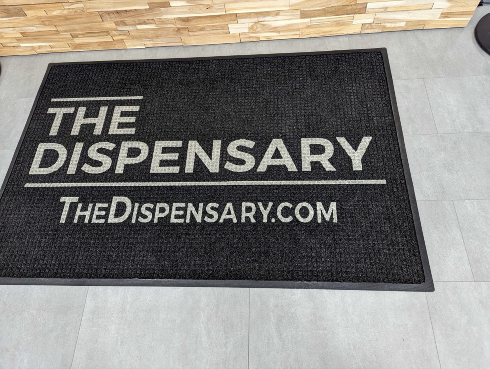 Branded entry mat at the storefront