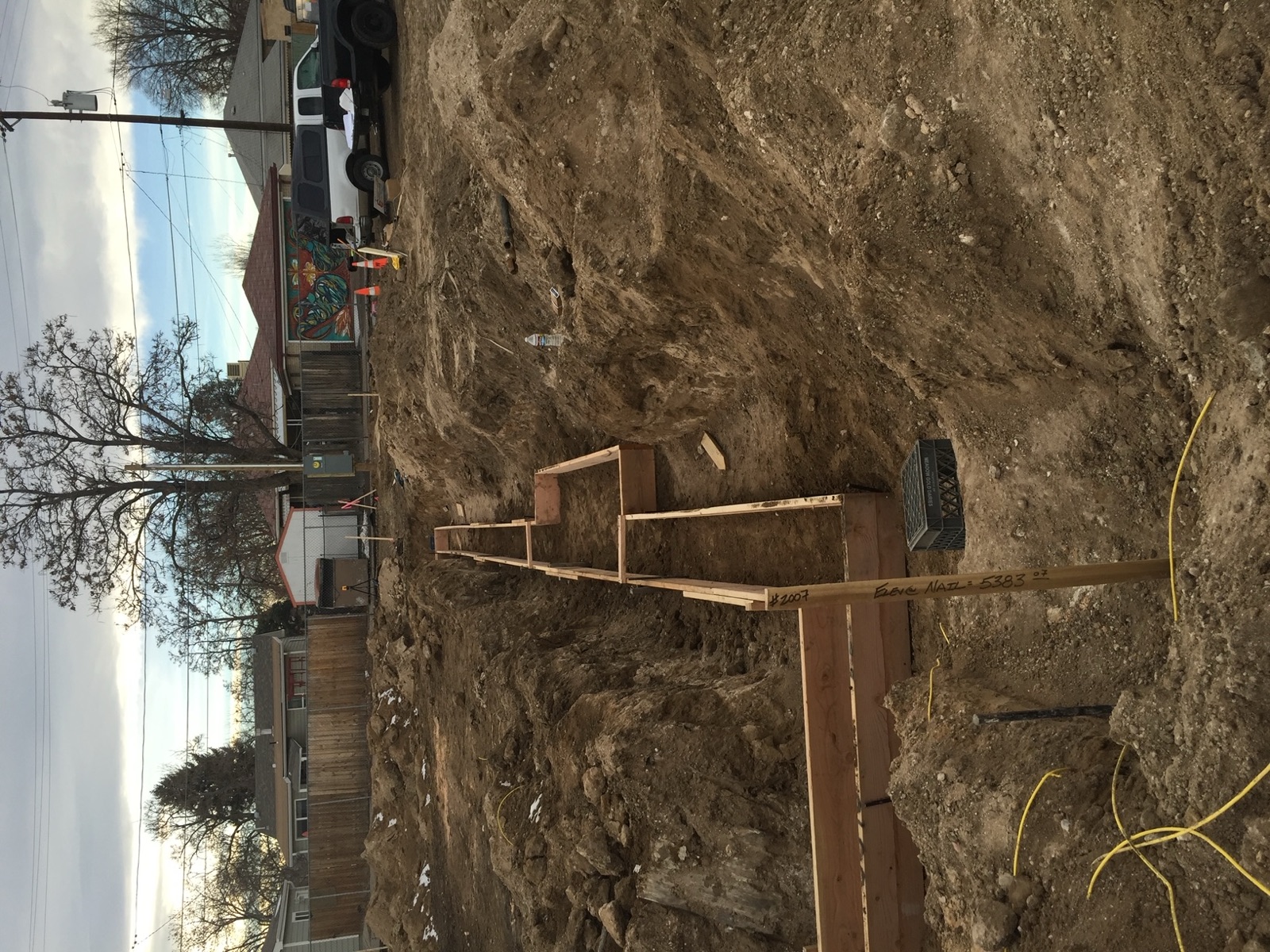 Underground plumbing rough-in during site excavation