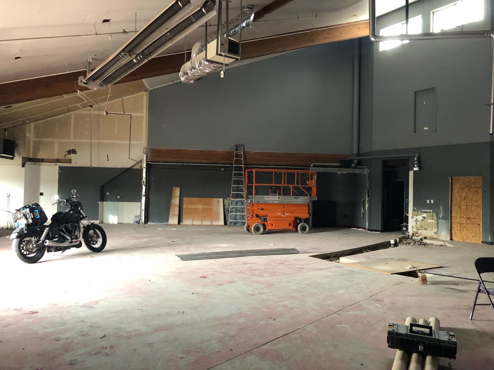 Open retail shell with framing exposed early in the build-out